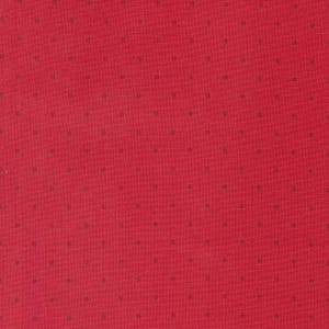 May include: Red fabric with a small, dark grey polka dot pattern.