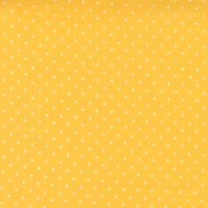 May include: Yellow fabric with a white star pattern.