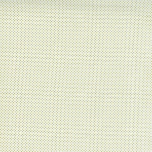 May include: A white fabric with a subtle green polka dot pattern. The dots are evenly spaced and create a delicate texture.