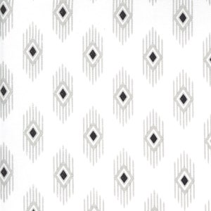 May include: White fabric with a repeating pattern of gray and black diamond shapes. Each diamond has a black center and is surrounded by a gray and white striped design. The pattern is evenly spaced across the fabric.