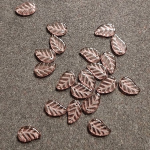15 Pieces Light Purple Translucent Czech Pressed Glass Leaf Shaped Beads. 14mm x 9mm. Perfect for Your Own Jewelry or Craft Designs.