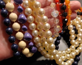 8 Acrylic Necklaces that are Different Lengths, Colors. Some with Clasps. For Crafting not a Toy. All But One are Glued to the String.