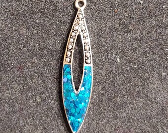 Silvertone and Peacock Color Pendant. Bottom Half Glitter Embedded in Epoxy Resin. Jewelry Making Component