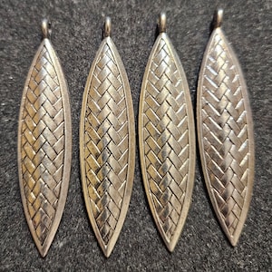 1 Silvertone Metallic Shield Shaped Pendant or Focal Bead. Large Stringing Hole. 2-1/2&quot; Long. For Your Jewelry or Crafting Needs.