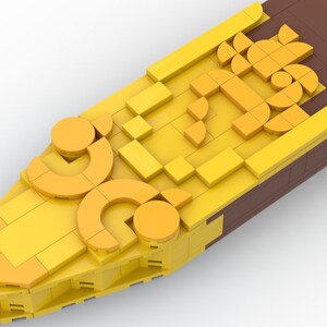 May include: A yellow and brown Lego model of a ship's prow with a decorative design of circles and squares.