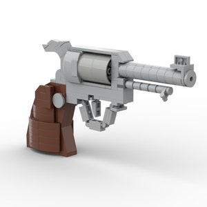 May include: A silver and brown Lego revolver model with a detailed barrel and a brown plastic handle.