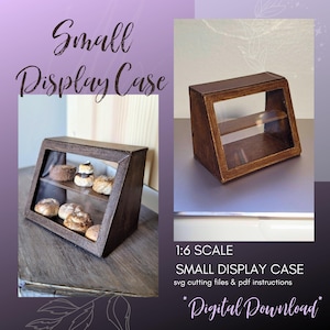 May include: A miniature wooden display case with two shelves and a glass front. The case is brown and has a distressed finish. The text "1:6 SCALE SMALL DISPLAY CASE svg cutting files & pdf instructions *Digital Download*" is printed below the case.
