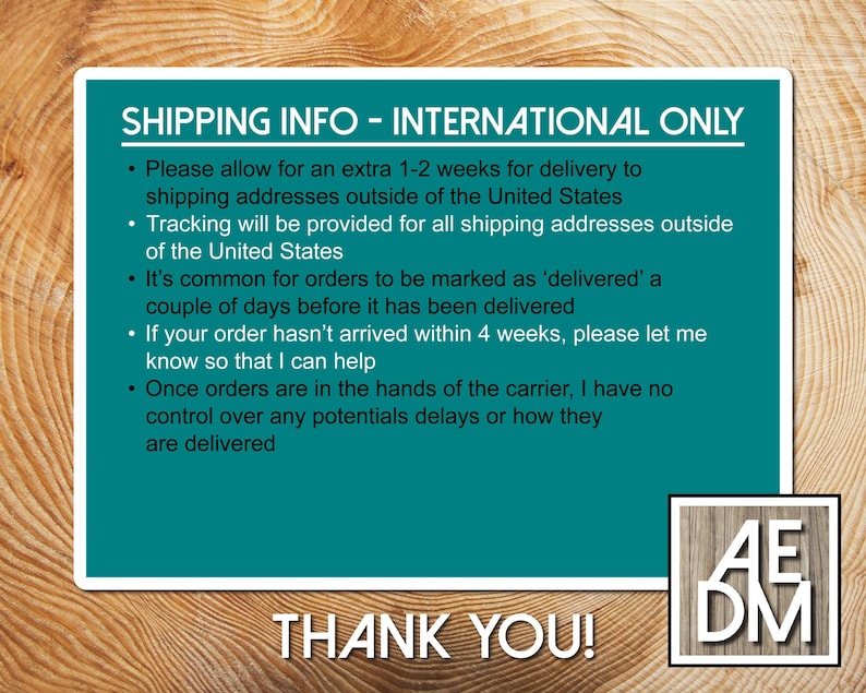 May include: A rectangular teal sign with white text titled SHIPPING INFO - INTERNATIONAL ONLY, detailing delivery timelines, tracking, and carrier policies. A small square logo with the letters AEDM is in the bottom right corner.