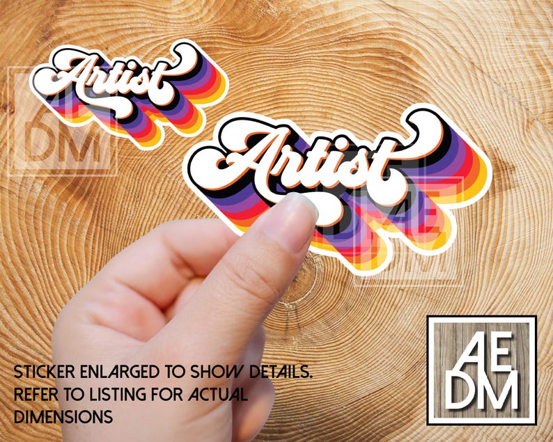 May include: Two die-cut stickers featuring the word Artist in a white cursive font with a thick black outline. Behind the text are layered, repeating drop shadows in shades of purple, blue, green, yellow, orange, and red, creating a vibrant effect.