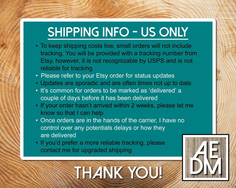 May include: A rectangular teal sign with white text titled SHIPPING INFO - US ONLY, detailing policies regarding tracking, delivery status, and carrier delays, with a small square logo in the bottom right corner containing the letters AEDM.