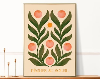 May include: A peach-colored print with a stylized design of green leaves and peach fruit. The text "PÊCHES AU SOLEIL" is at the bottom of the print.