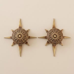 Tiradores antiguos con forma de margarita y placa trasera dorada con diseño de estrella, herrajes redondos de estilo rococó para armarios de cocina y cajones de cómoda.