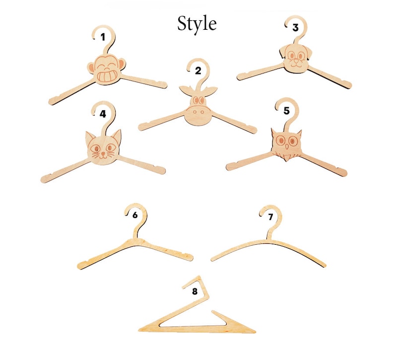 May include: A collection of eight light-colored wooden clothes hangers labeled with numbers one through eight. Five hangers feature animal head designs including a monkey, cow, dog, cat, and owl. Three hangers have plain, curved, or angular shapes.