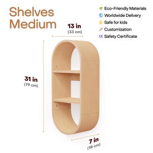 May include: A medium-sized, light-colored wooden shelf unit with an oval shape. It has three shelves and is 31 inches (79 cm) tall, 13 inches (33 cm) wide, and 7 inches (18 cm) deep. The text "Shelves Medium" is at the top.