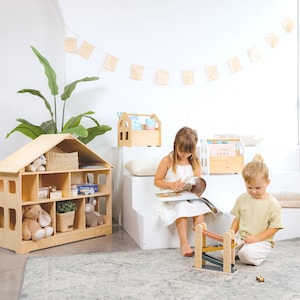 Minimalist Montessori dollhouse bookcase for nursery organization, toy rotation, and imaginative play