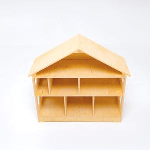 Close-up detail of premium wooden dollhouse shelf showing smooth edges and natural craftsmanship