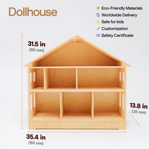 May include: A light-colored wooden dollhouse with a gabled roof, featuring two levels and six open rooms. The structure measures 31.5 inches in height, 35.4 inches in width, and 13.8 inches in depth. The text Dollhouse is visible at the top left.