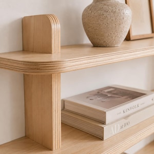 Close-up of rounded edges, layered birch plywood, natural wood grain, and handcrafted joinery.