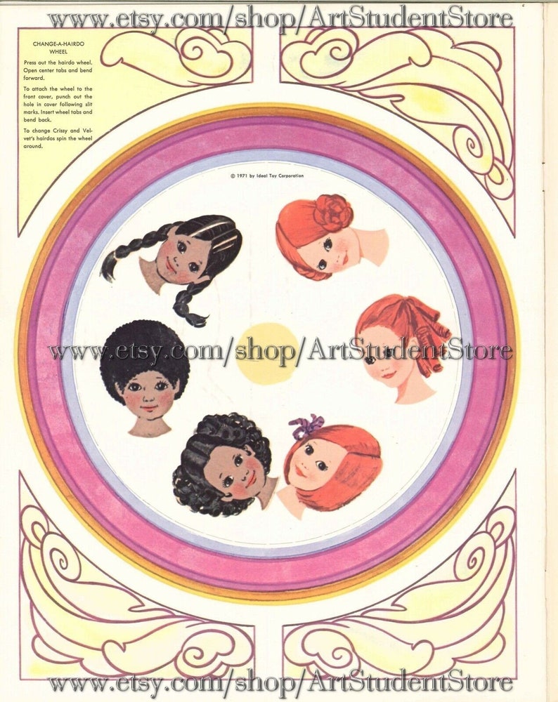 May include: A paper doll wheel with four different hairstyles for girls. The wheel is pink, yellow, and orange. The hairstyles are black, brown, and red. The text on the wheel says "Change-A-Hairdo Wheel".