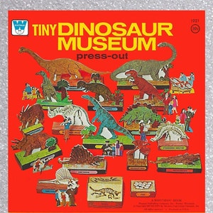 May include: A vintage Whitman Tiny Dinosaur Museum press-out kit featuring a red background with various dinosaurs, skeletons, and prehistoric creatures. The kit includes a Stegosaurus skeleton, Protoceratops, Dimetrodon, and more.