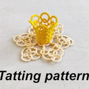 May include: A yellow crocheted doily with a yellow crocheted flower in the center. The doily is on a white background. "Tatting pattern" is written in black text below the doily.
