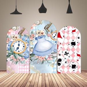 May include: Three arched panels with Alice in Wonderland illustrations. The panels feature a clock, playing cards, and Alice in a blue dress. Floral and decorative elements are also present, with a pink and blue color scheme.