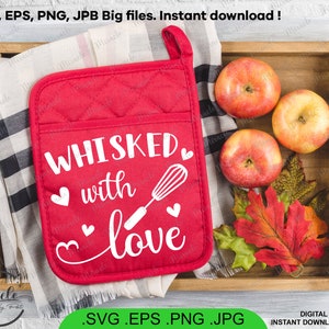May include: Red pot holder with the text "WHISKED with love" in white lettering and a white whisk illustration. The pot holder is on a wooden surface with apples and fall leaves.