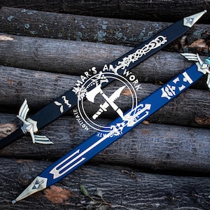 May include: Two decorative swords with silver accents and intricate designs. One sword is black with silver detailing, and the other is blue with silver and gold accents. The swords are displayed on a background of wooden logs. The image includes the text "MAR'S ART WORK MOTIVATE".