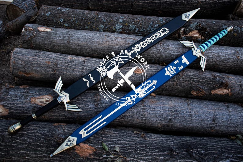 May include: Two decorative swords with silver accents and intricate designs. One sword is black with silver detailing, and the other is blue with silver and gold accents. The swords are displayed on a background of wooden logs. The image includes the text "MAR'S ART WORK MOTIVATE".