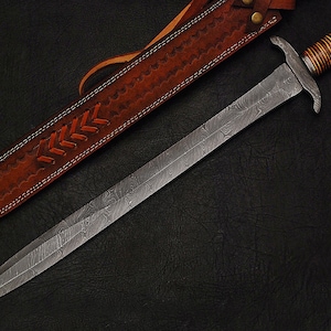 May include: A silver sword with a brown leather scabbard. The sword has a patterned blade and a brown wooden handle.