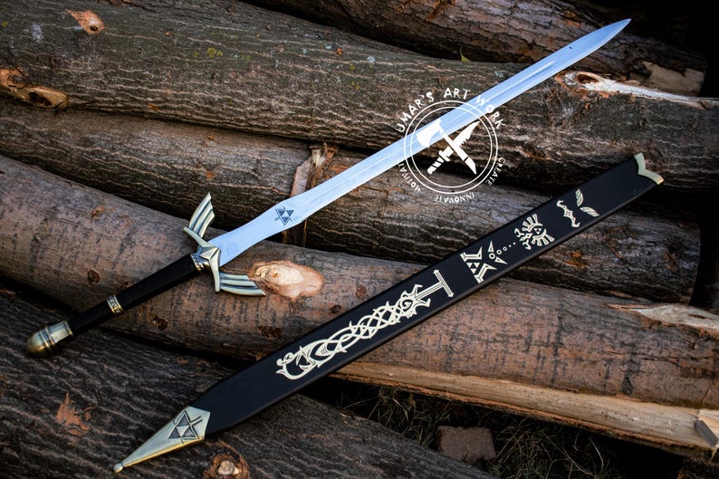 May include: A silver-bladed sword with a black handle and gold accents, resting on a pile of logs. The sword has a decorative hilt and a sheath with intricate designs. The blade has a blue triangle symbol.