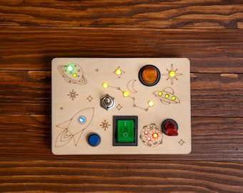 Wooden board with a light switch - a sensory Montessori toy for toddlers and children