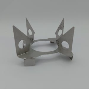 Cuisson d&#39;émaillage Dessous de plat Cuisson d&#39;émaillage Échasses 4 pointes 52-95 mm hauteur 50 mm. Convient à la plupart des petits fours