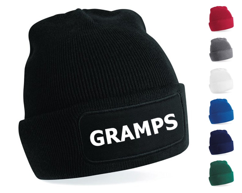 Puede incluir: Gorro de punto negro con un parche blanco que dice "GRAMPS". El gorro se muestra en varios colores: rojo, gris, blanco, azul, azul marino y verde.