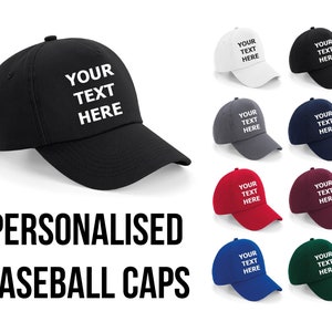 May include: A set of ten personalized baseball caps in various colors, including black, white, gray, blue, red, and green. Each cap features the text "YOUR TEXT HERE" in white.