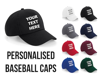 May include: A set of ten personalized baseball caps in various colors, including black, white, gray, blue, red, and green. Each cap features the text "YOUR TEXT HERE" in white.