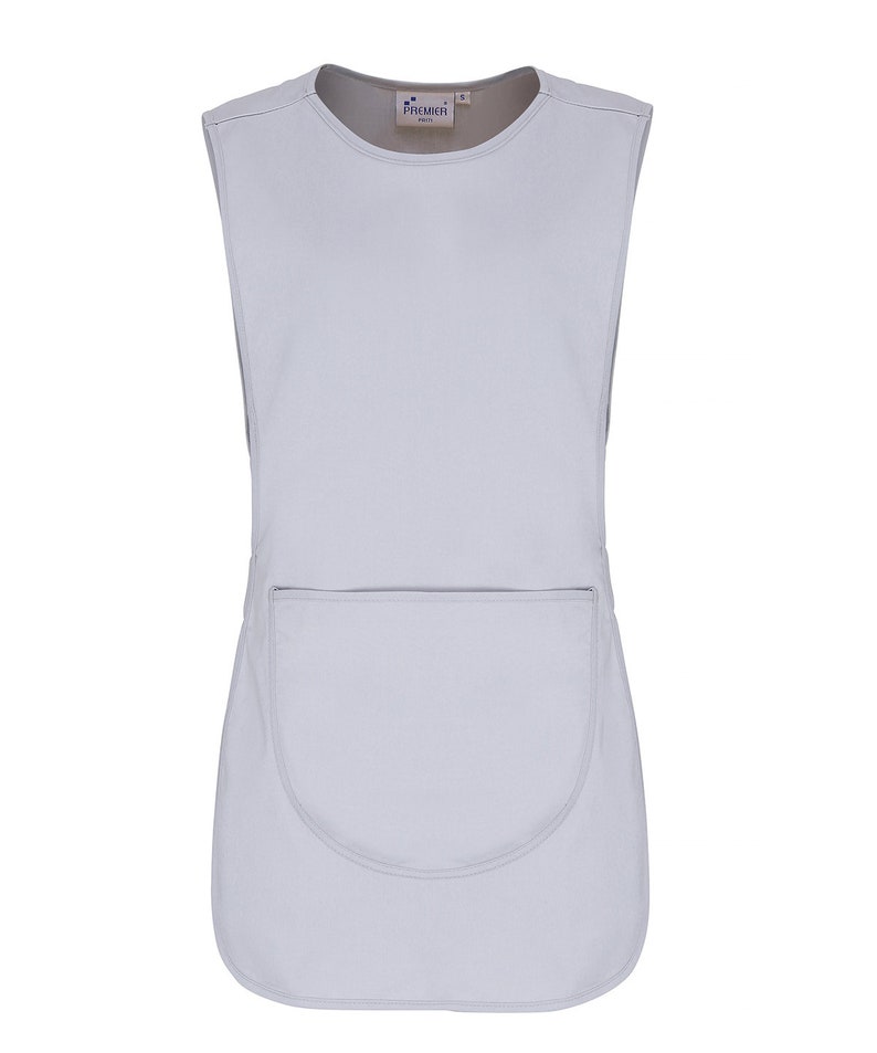 May include: A light gray sleeveless apron with a single large pocket on the front. The apron has a rounded bottom hem and a label that reads "Premier" in the upper center.