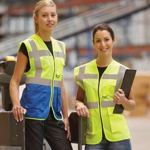May include: Two people wearing yellow and blue safety vests with reflective strips. The vests have multiple pockets and a zip closure.