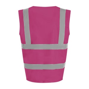 May include: A pink safety vest with reflective silver stripes. The vest has a V-neck and is sleeveless.
