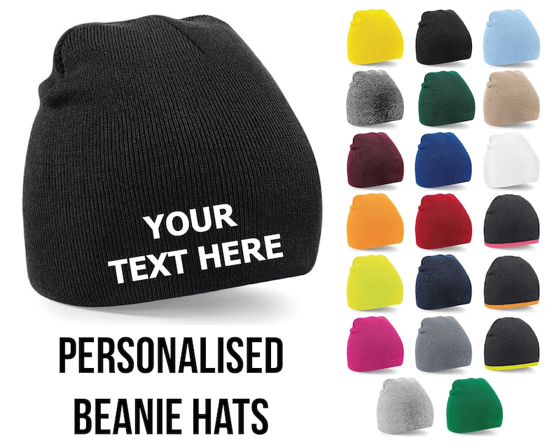 May include: A black beanie hat with the text "YOUR TEXT HERE" embroidered in white. The image shows a variety of colors and styles of beanie hats.