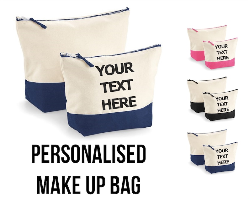 May include: Two personalized canvas makeup bags with a zipper closure. The larger bag is cream with a navy blue bottom and the smaller bag is cream with a pink bottom. Both bags have the text "YOUR TEXT HERE" printed in black.
