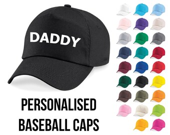 May include: Black baseball cap with the word "DADDY" in white lettering.  A variety of colors are shown for personalization options.
