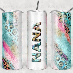 May include: White tumbler with a teal, pink, and gold glitter design. The tumbler has a leopard print pattern and the word "NANA" in large, bold letters.
