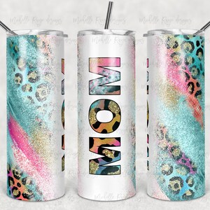 May include: A white tumbler with a colorful design featuring pink, blue, gold, and black leopard print. The word "MOM" is written in large letters on the tumbler.