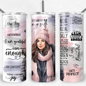 May include: Three stainless steel tumblers with a watercolor background and inspirational quotes. The tumblers feature a woman with long brown hair wearing a pink hat and scarf. The quotes include "I am worthy", "I stand up for myself", and "I am beautiful".