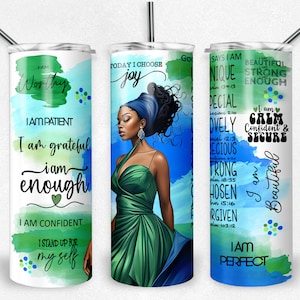 May include: Three stainless steel tumblers with inspirational quotes and a watercolor background. The tumblers feature a woman with a green dress and a blue background, a green and blue watercolor background, and a blue and green watercolor background.