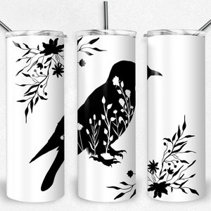 May include: Three white stainless steel tumblers with black silhouettes of a bird and floral designs. The bird is in the centre tumbler and the floral designs are on the left and right tumblers.