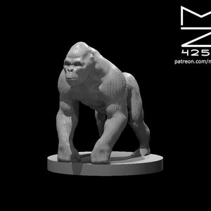 May include: A gray, detailed miniature figurine of a gorilla standing on a round base.