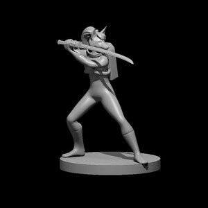 May include: A gray figurine of a female character with a fox head, holding a sword in a fighting pose. The character is wearing a black suit and has a belt with a pouch. The figurine is standing on a round base.