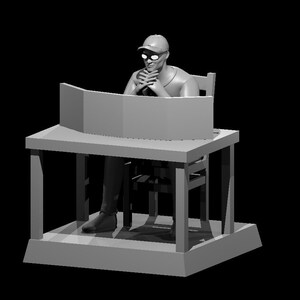 May include: A gray figurine of a person sitting at a desk with a curved screen. The person is wearing a cap and glasses and has their hands clasped in front of them.